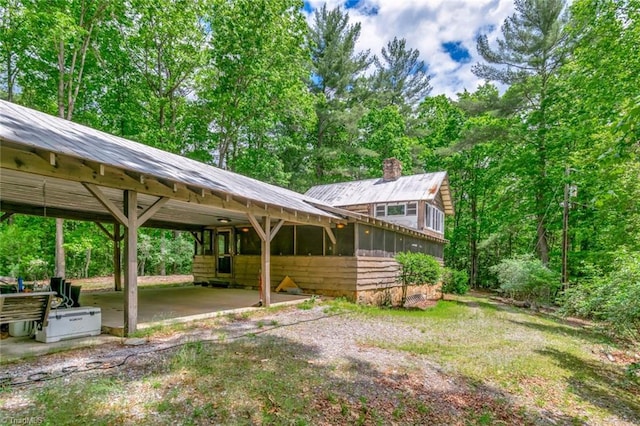 140 Blue Heron Ln, Wilkesboro, NC 28697 - view of yard with a sunroom and an attached carport