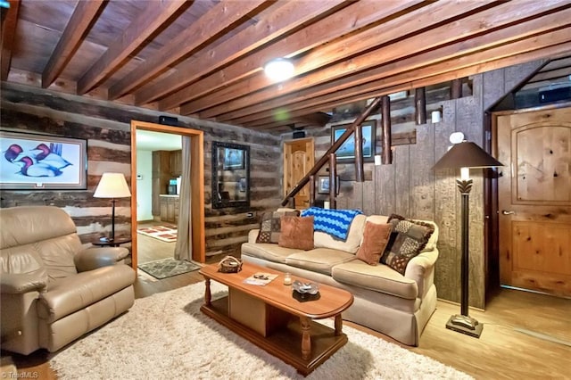 140 Blue Heron Ln, Wilkesboro, NC 28697 - living area featuring stairway, wooden walls, wood finished floors, and beamed ceiling