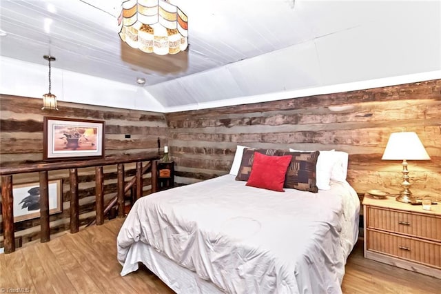 140 Blue Heron Ln, Wilkesboro, NC 28697 - bedroom with wooden walls, light wood finished floors, and lofted ceiling
