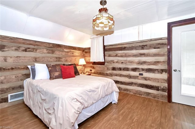 140 Blue Heron Ln, Wilkesboro, NC 28697 - bedroom featuring wooden walls and wood finished floors