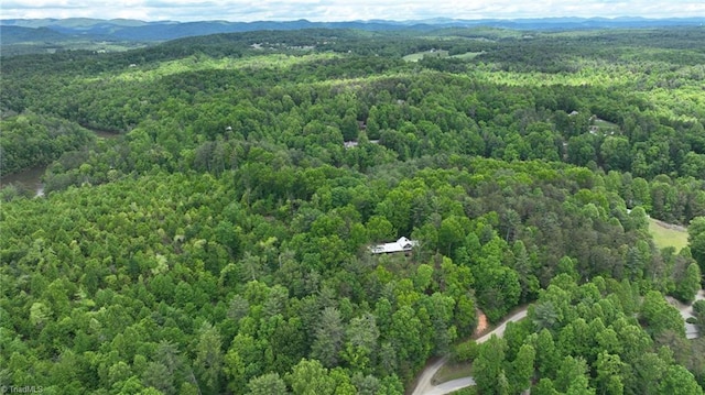 140 Blue Heron Ln, Wilkesboro, NC 28697 - bird's eye view of a heavily wooded area and a mountain backdrop