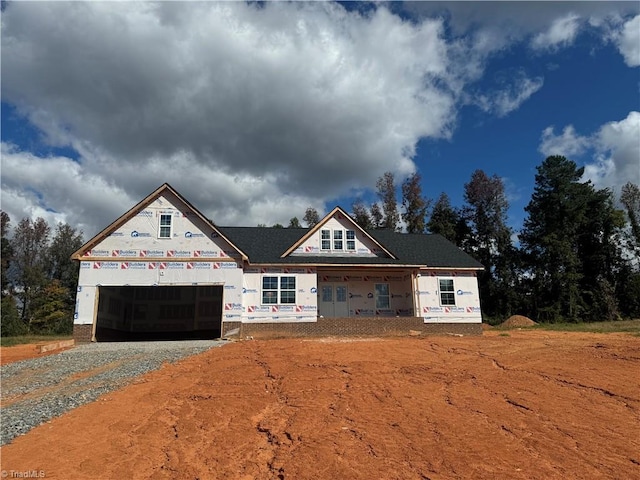 unfinished property with a garage