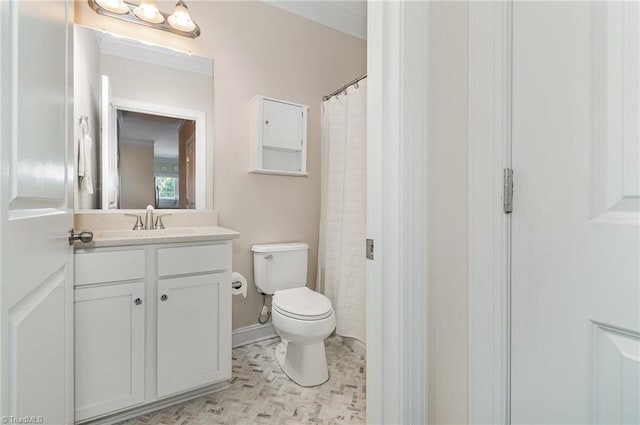 bathroom with vanity, curtained shower, crown molding, and toilet