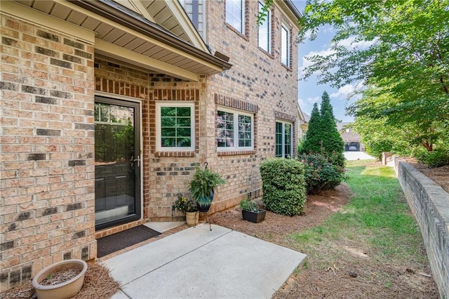 property entrance featuring a patio area