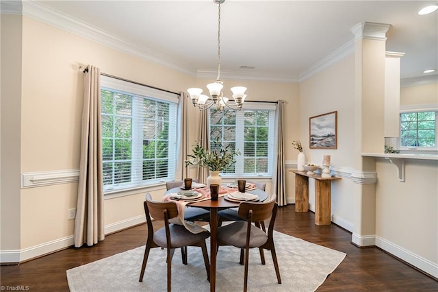 dining space featuring crown molding, dark wood-type flooring, and a wealth of natural light