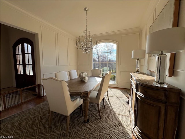 6792 Meadow View Dr, Summerfield, NC 27358 - dining area with a decorative wall, a chandelier, and arched walkways