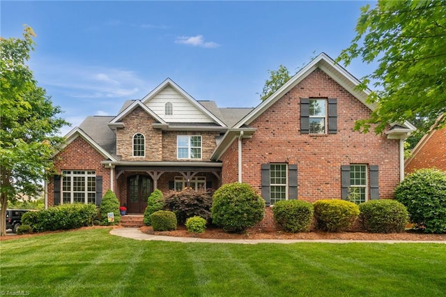 6122 Olde Fields Way, Pfafftown, NC 27040 - traditional home with a front yard and brick siding