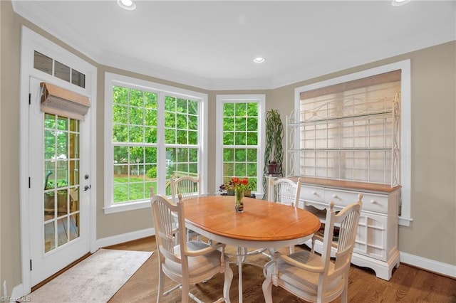 6122 Olde Fields Way, Pfafftown, NC 27040 - dining area featuring baseboards, wood finished floors, ornamental molding, and recessed lighting