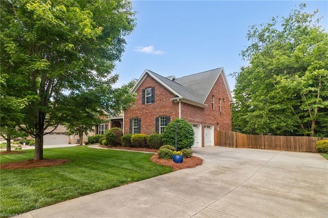6122 Olde Fields Way, Pfafftown, NC 27040 - traditional-style home featuring concrete driveway, brick siding, and an attached garage