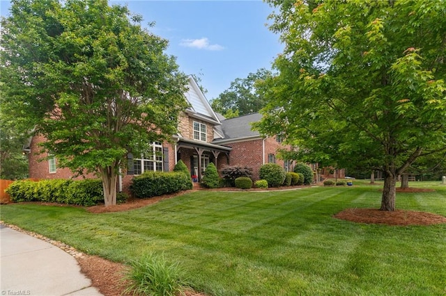 6122 Olde Fields Way, Pfafftown, NC 27040 - view of front of home featuring brick siding and a front yard