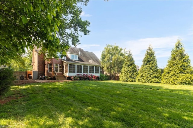 6122 Olde Fields Way, Pfafftown, NC 27040 - back of house with a yard and a sunroom