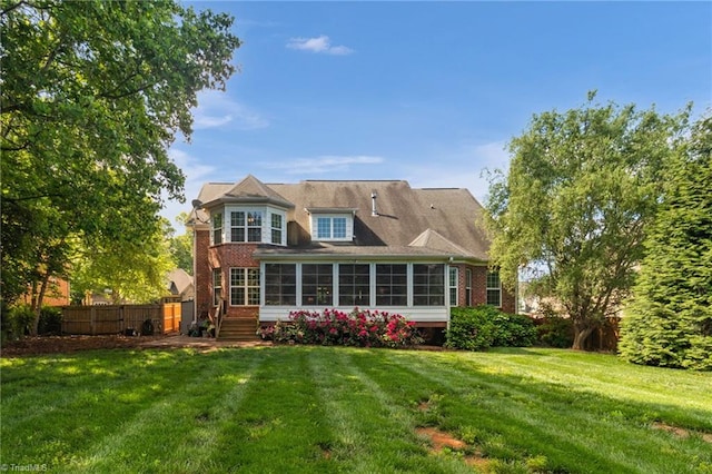 6122 Olde Fields Way, Pfafftown, NC 27040 - rear view of property with a sunroom and brick siding