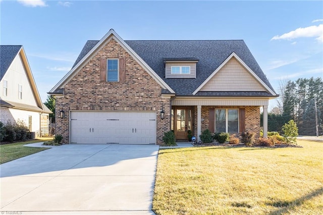 craftsman house with a garage, a porch, and a front lawn