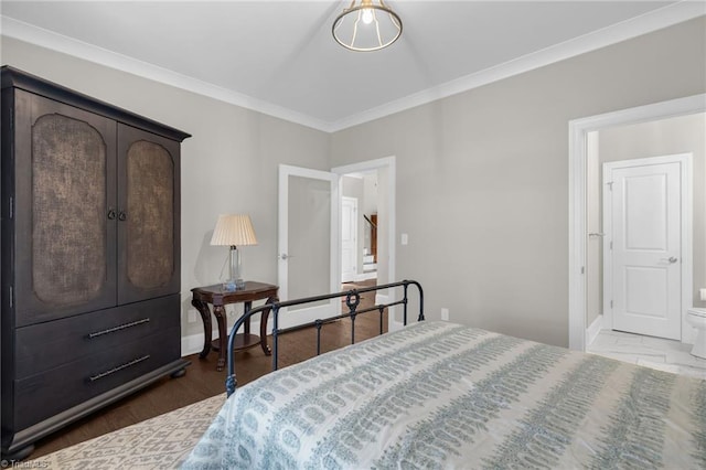 bedroom featuring crown molding and dark hardwood / wood-style flooring