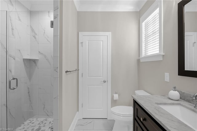 bathroom featuring vanity, toilet, and a shower with shower door