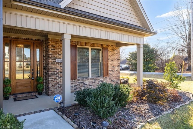 entrance to property featuring covered porch