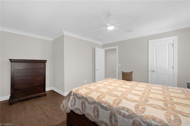 bedroom with ornamental molding, ceiling fan, and dark hardwood / wood-style flooring