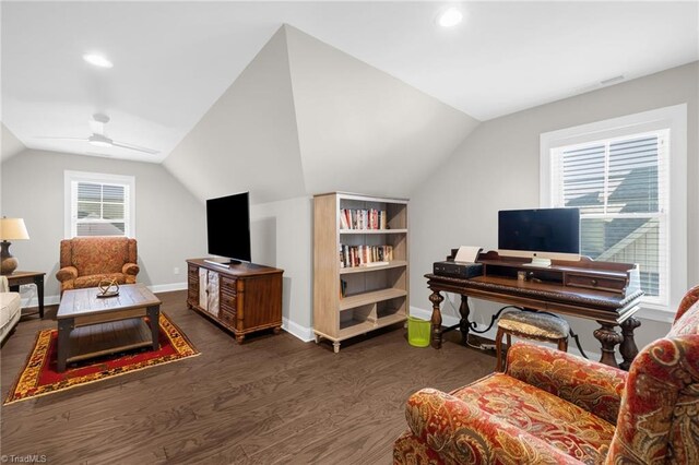 living room featuring dark hardwood / wood-style flooring, vaulted ceiling, and ceiling fan