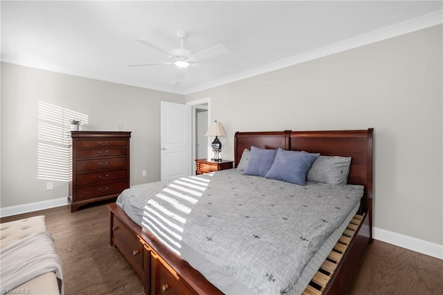 bedroom with ornamental molding, dark hardwood / wood-style floors, and ceiling fan