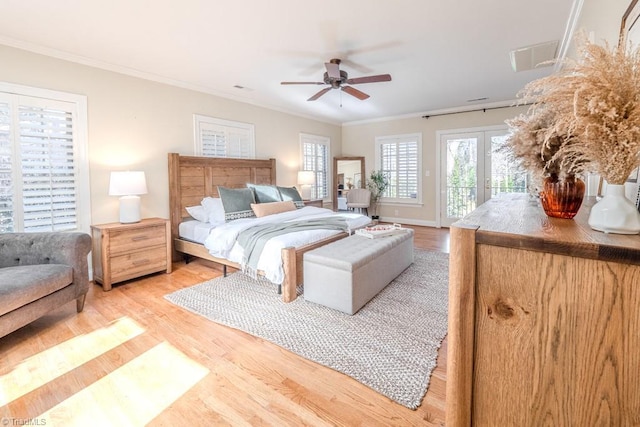 bedroom featuring hardwood / wood-style flooring, ornamental molding, access to exterior, and french doors