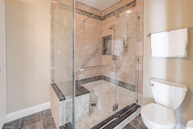 bathroom with walk in shower and toilet