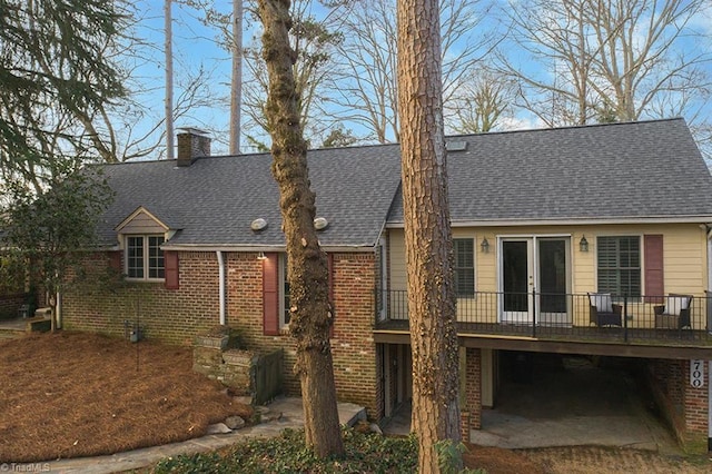 rear view of house with a wooden deck