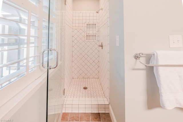 bathroom with a shower with shower door