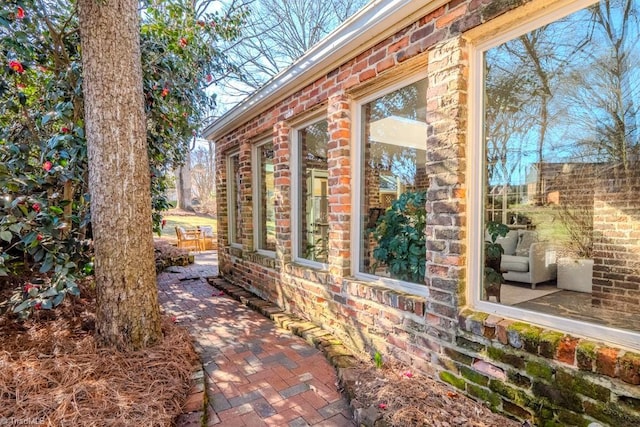 view of side of home featuring a patio