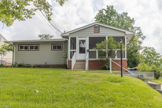 2203 Van Wert St, Greensboro, NC 27403 - view of front of home with a sunroom