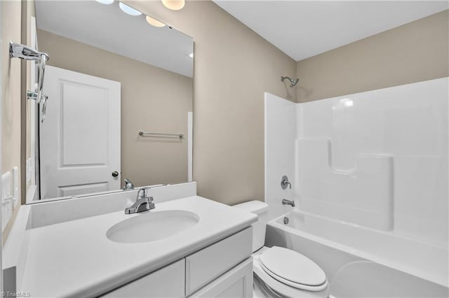 full bathroom featuring toilet, vanity, and shower / washtub combination
