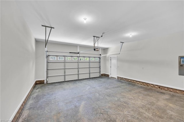 garage with baseboards and a garage door opener
