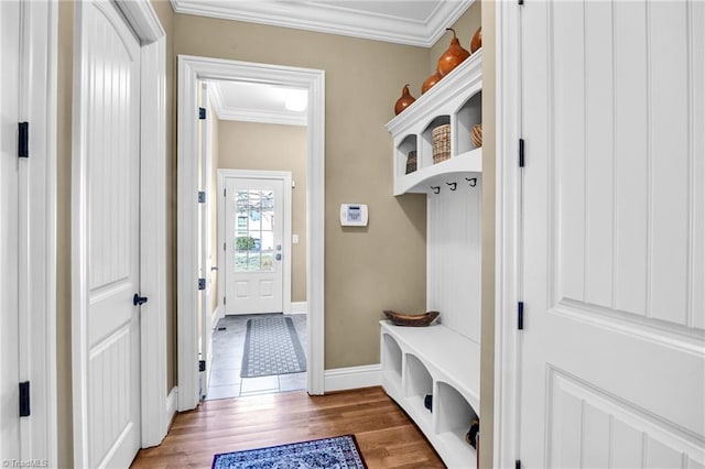 mudroom featuring hardwood / wood-style flooring and ornamental molding