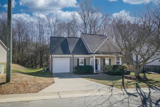 view of front of home with a garage and a front lawn