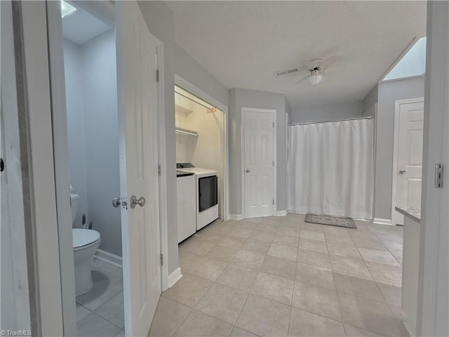 12 Cedar Knoll Ct Unit 12, Greensboro, NC 27407 - bathroom with washer / clothes dryer, tile patterned flooring, a textured ceiling, and ceiling fan