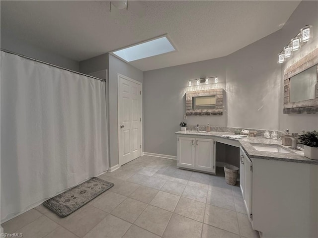 12 Cedar Knoll Ct Unit 12, Greensboro, NC 27407 - full bath featuring a skylight, tile patterned flooring, double vanity, a textured ceiling, and a shower with shower curtain