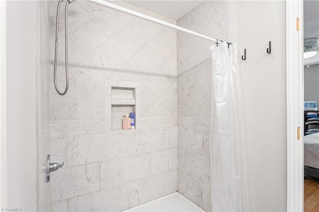 full bathroom with connected bathroom and a shower with shower curtain