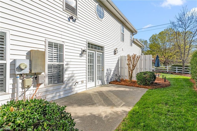 exterior space with a patio, fence, and a yard