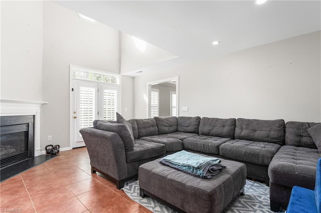 tiled living room featuring a fireplace and recessed lighting