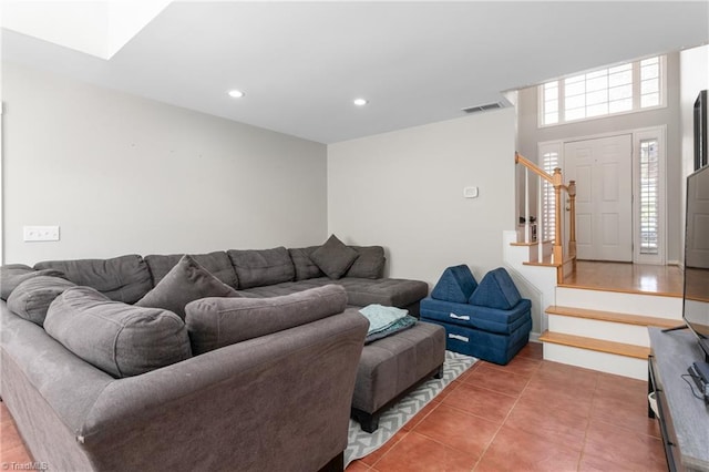 tiled living room with recessed lighting, stairs, and visible vents