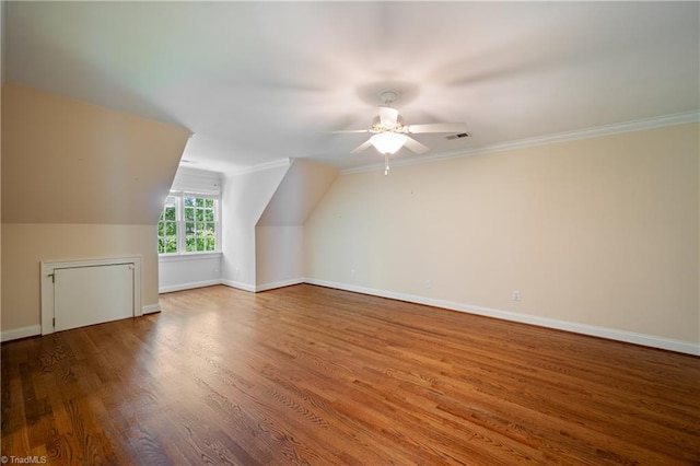 bonus room with ceiling fan, baseboards, wood finished floors, vaulted ceiling, and visible vents