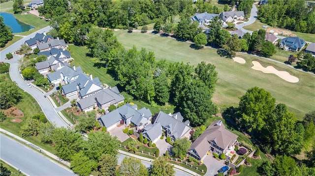 birds eye view of property featuring a water view, golf course view, and a residential view