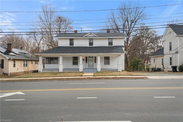 view of front of house featuring central AC unit and covered porch