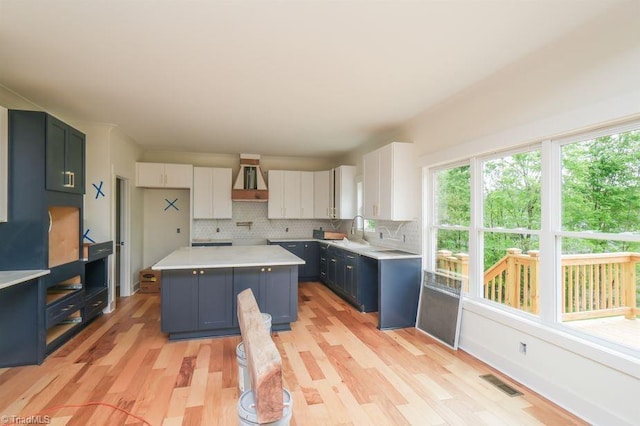 3799 Peony Way, Clemmons, NC 27012 - kitchen with visible vents, extractor fan, light wood finished floors, and a healthy amount of sunlight
