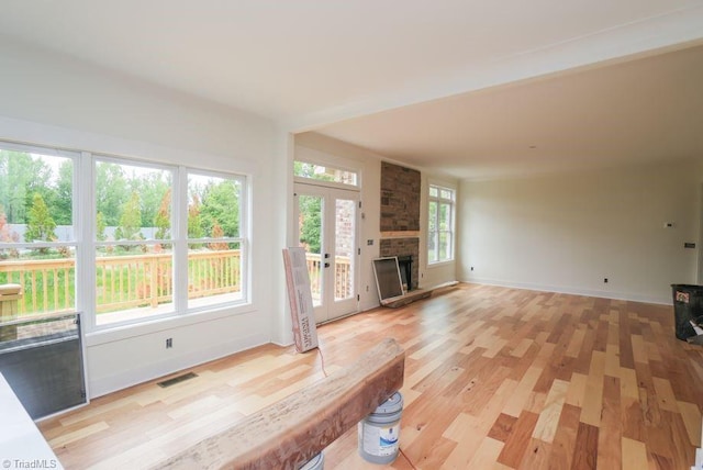 3799 Peony Way, Clemmons, NC 27012 - unfurnished living room with a fireplace, visible vents, light wood-style flooring, and baseboards