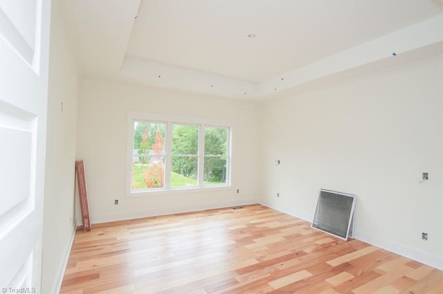 3799 Peony Way, Clemmons, NC 27012 - empty room with baseboards, a raised ceiling, and light wood-style floors