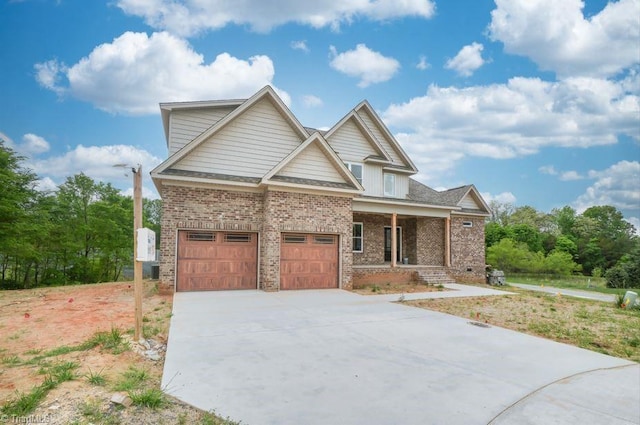 3799 Peony Way, Clemmons, NC 27012 - craftsman-style house with covered porch, brick siding, and concrete driveway