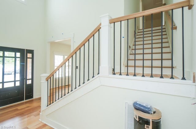 3799 Peony Way, Clemmons, NC 27012 - foyer featuring wood finished floors, a wealth of natural light, stairs, and a towering ceiling