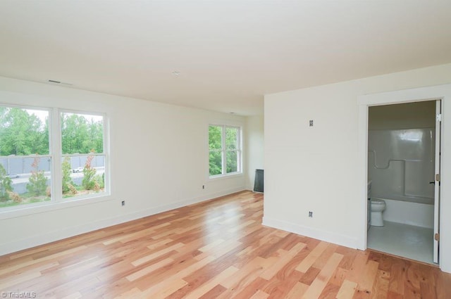 3799 Peony Way, Clemmons, NC 27012 - spare room featuring light wood-type flooring and baseboards