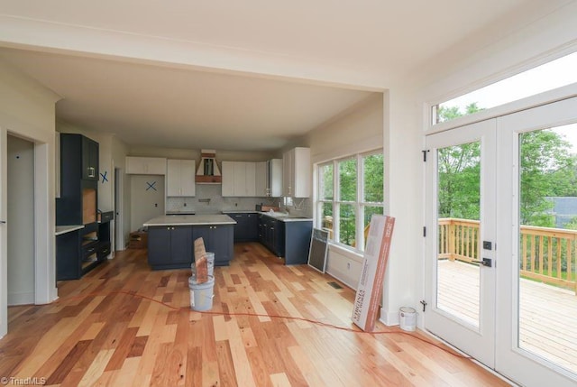 3799 Peony Way, Clemmons, NC 27012 - kitchen with tasteful backsplash, a center island, light wood finished floors, and plenty of natural light
