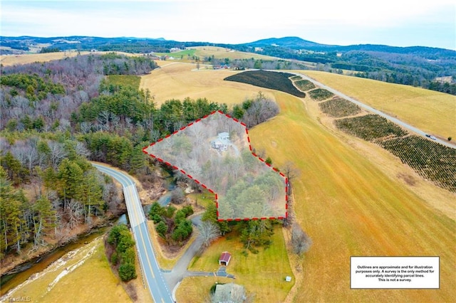 aerial view with a rural view and a mountain view